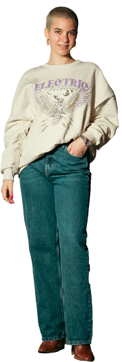 woman with buzzed bleach hair in a comfortable casual outfit