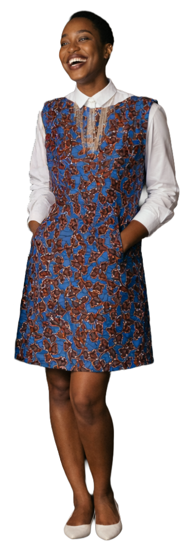 woman of color wearing a trendy dress, looking at the women to her right smiling