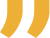 Close-up of a yellow quotation mark symbol