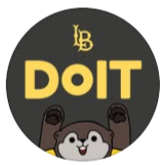 A circular logo with a black background, featuring the letters 'LB' at the top, the word 'DO IT' in yellow in the center, and a cartoon character with raised arms and a smiling face at the bottom.