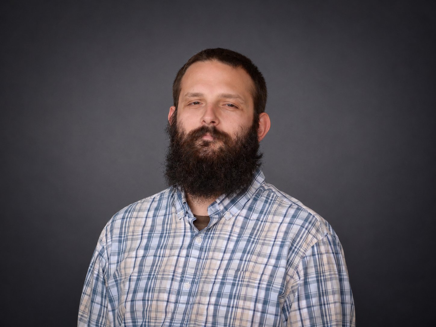 Taylor Seamon, headshot filler of project manager at audio visual company OAV, about us page on website.