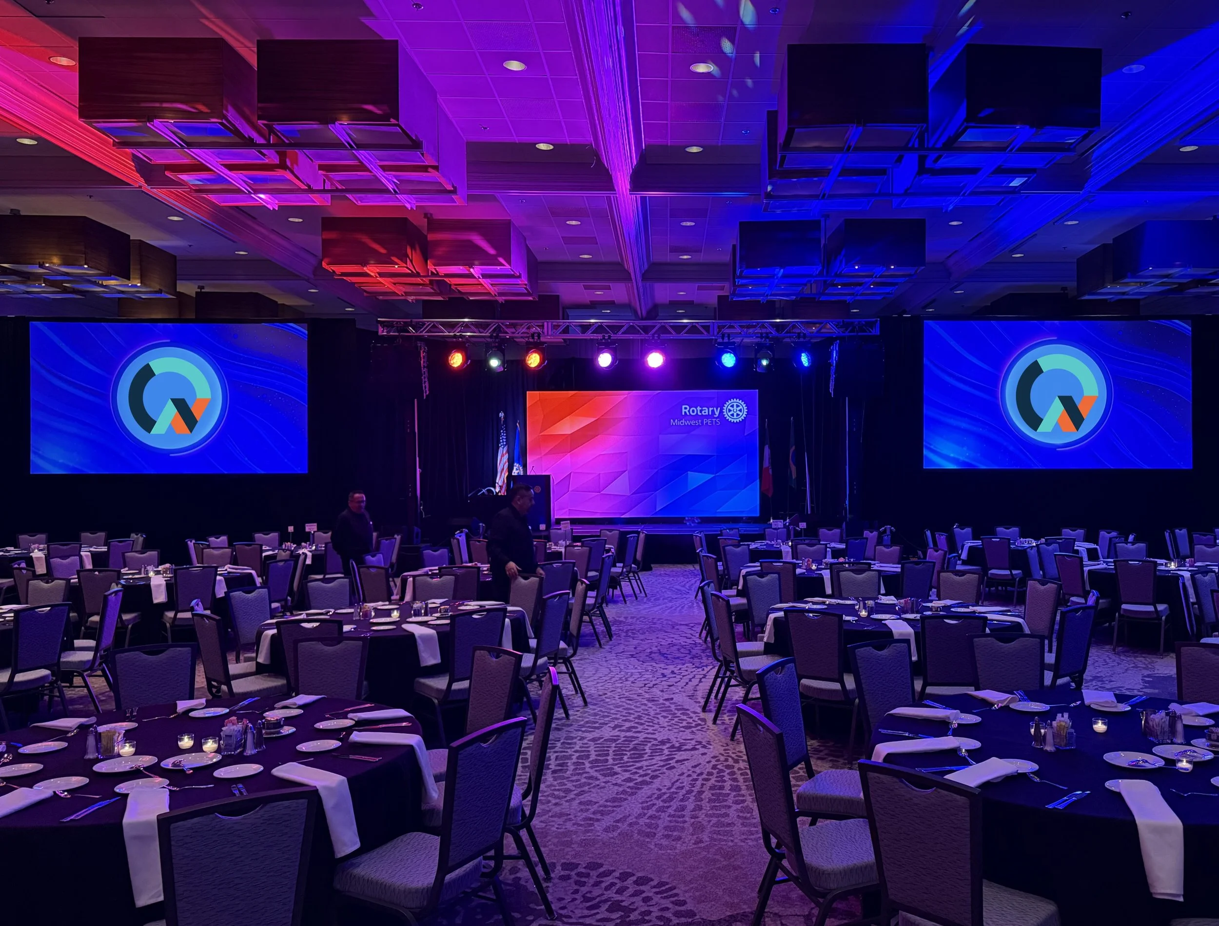 General Session to Mid-west PETS Rotary International conference in Chicago, LED Video wall stage backdrop, stage, dual projection, Martin professional lighting, staged for session. Rotary logo on video wall, banquet hall set at Westin in Chicago.