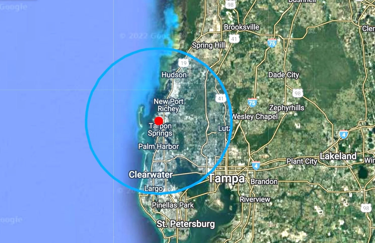 Map of the Tampa, Florida area showing a circle centered near Tarpon Springs and surrounding cities, St. Petersburg, Pinellas Park, Largo, Clearwater, Palm Harbor, New Port Richey and Hudson. Central Florida Real Estate Sign Post Installation
