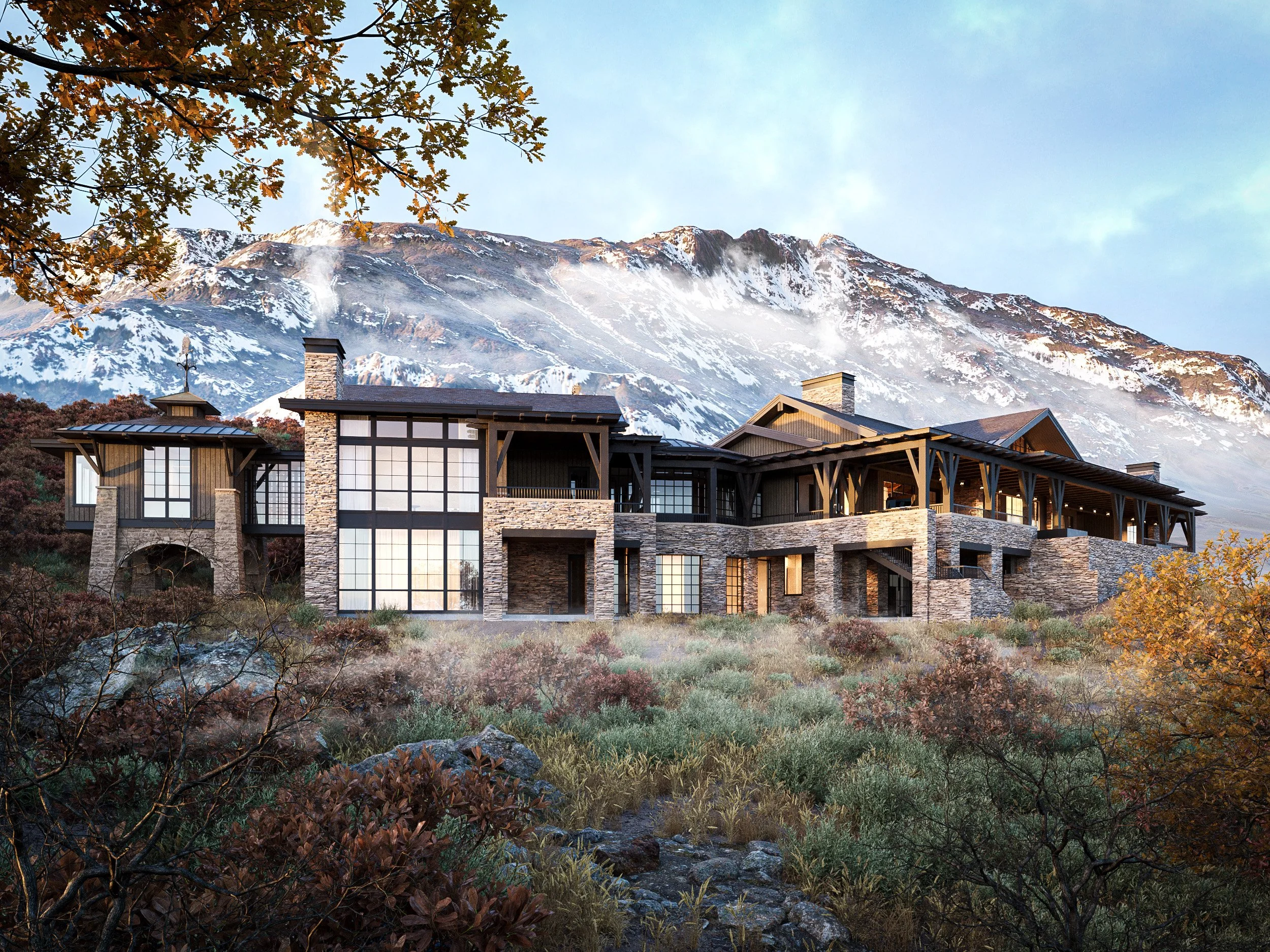 A modern house with large glass windows, stone accents, and wooden beams, situated on a hillside with autumn foliage and a mountain in the background.