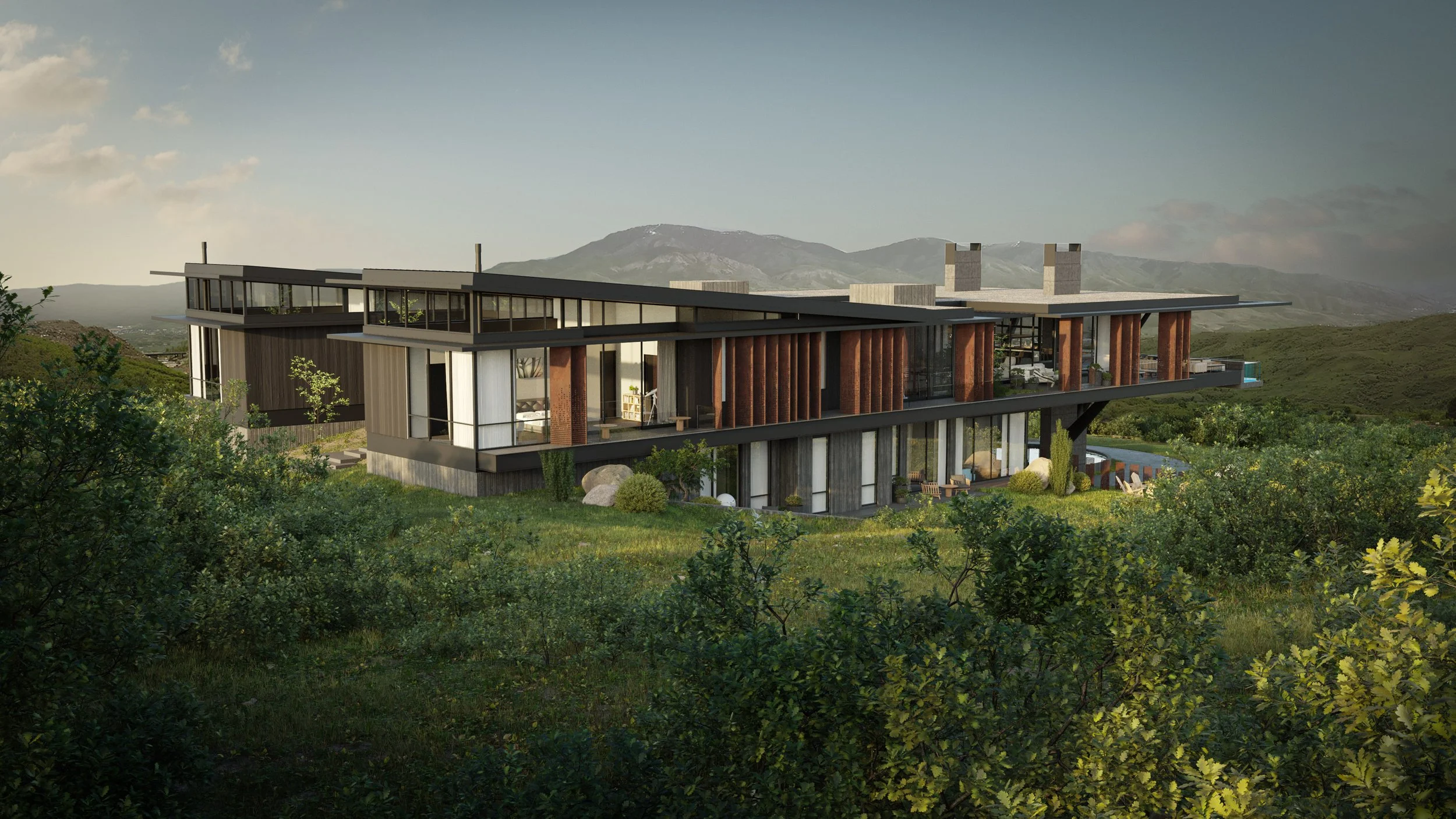 Modern multi-level house with large glass windows and wooden accents, situated on a grassy, hilly landscape with mountains in the background, during daylight.