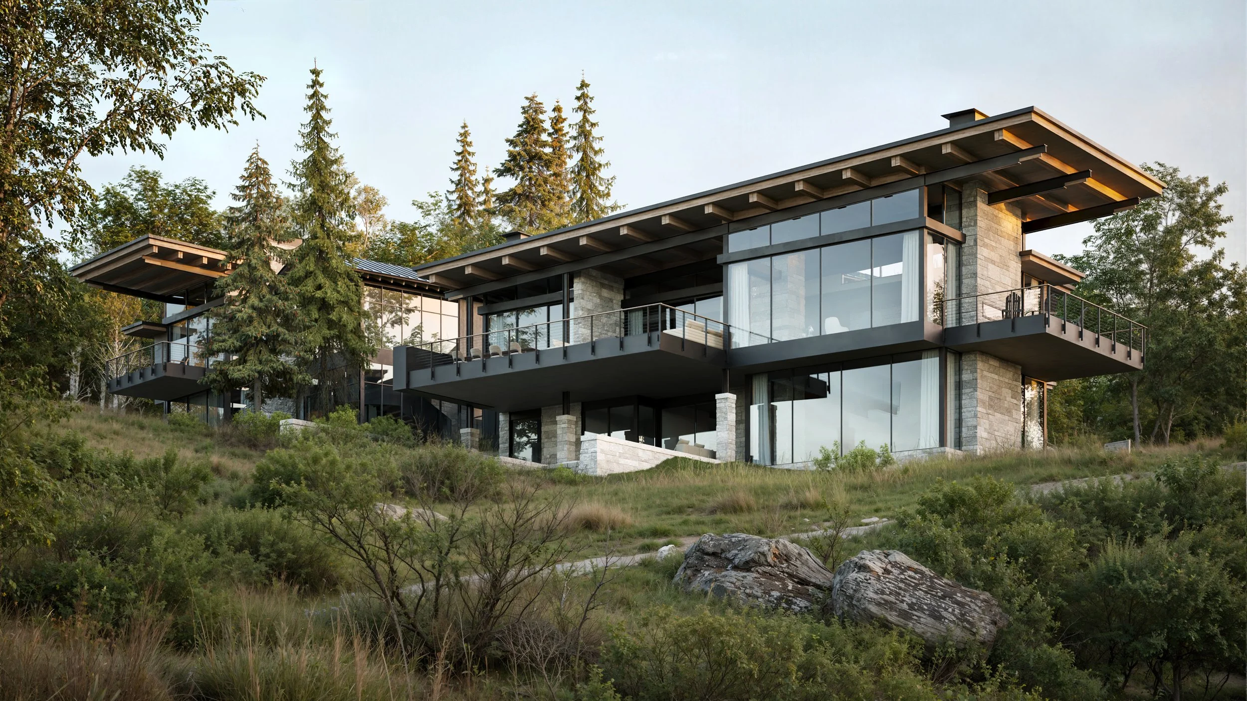 Modern multi-story house with large glass windows and balconies, situated on a hillside with trees and shrubs.