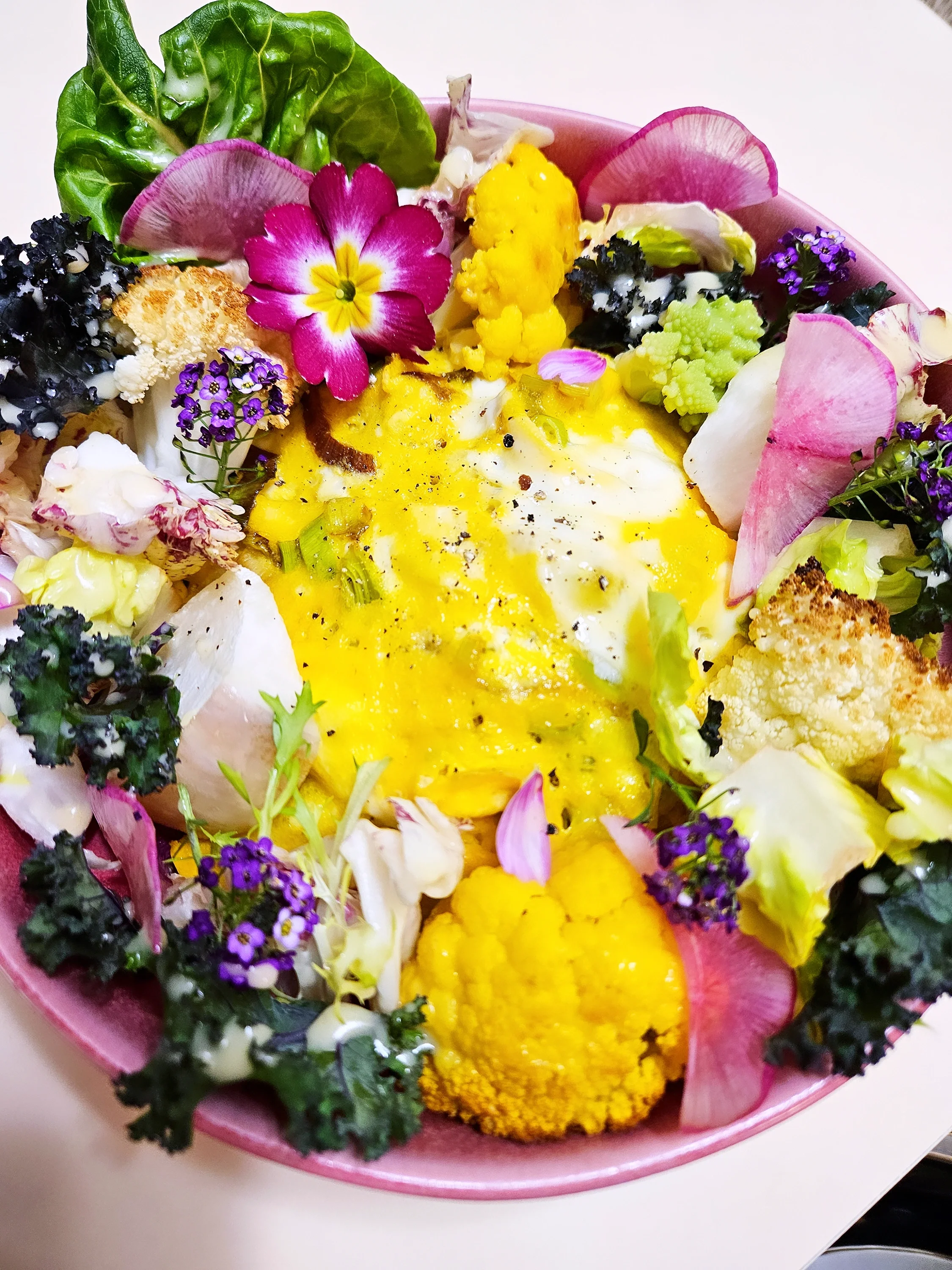 Healthy breakfast of brown rice, assorted vegetables, edible flowers, and scrambled egg with leeks by Chef Michelle of Masinloc Culinary