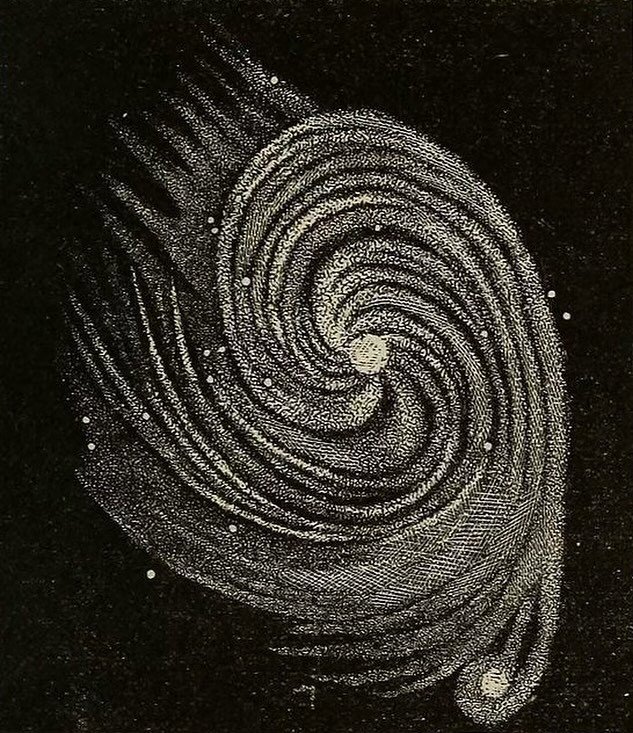 A glittery, white spiral galaxy against a black background.