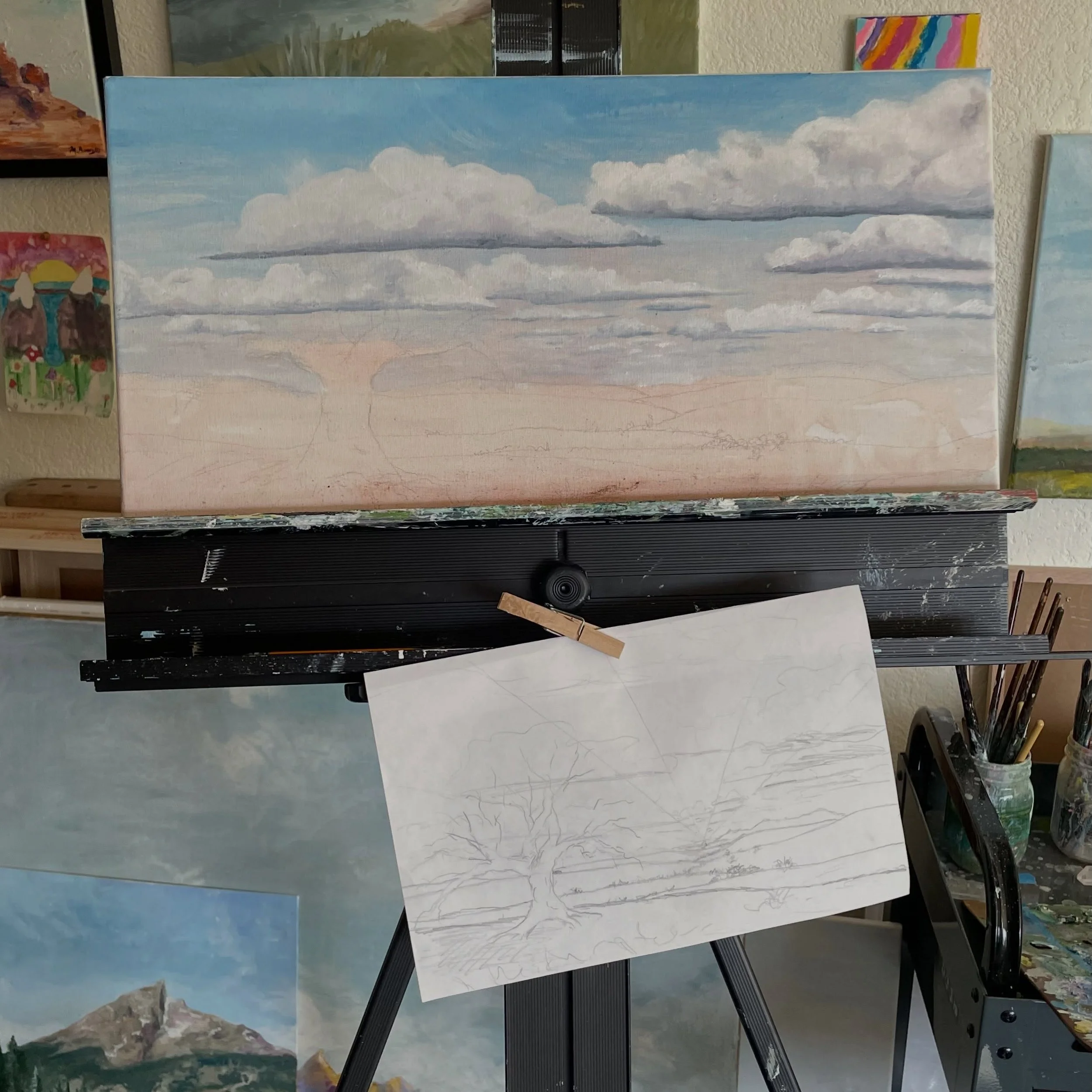 From concept to sketch to canvas. Oh and a cute little lady bug crawling on the ceiling of my studio.