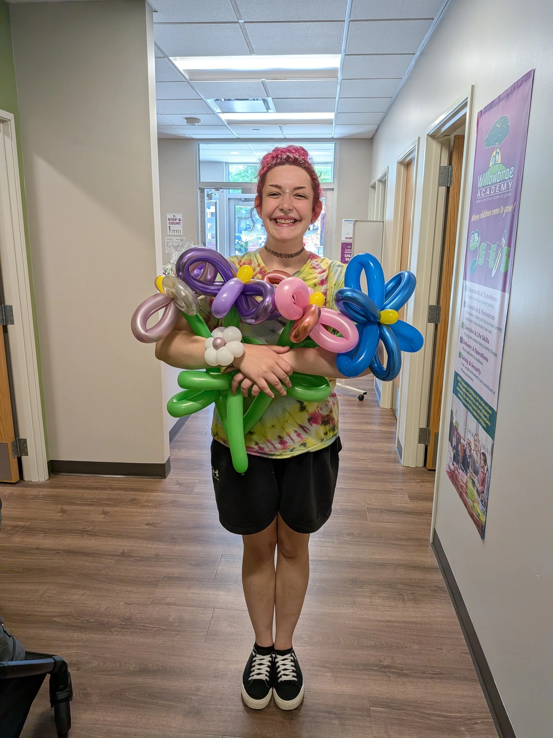 Customer holding Balloon Twisting Flowers