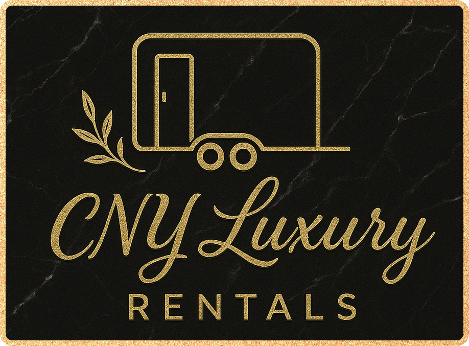 Advertising sign for CNY Luxury Rentals featuring a simple outline of a luxury trailer with a door and two wheels, accompanied by an olive branch, against a black marble background