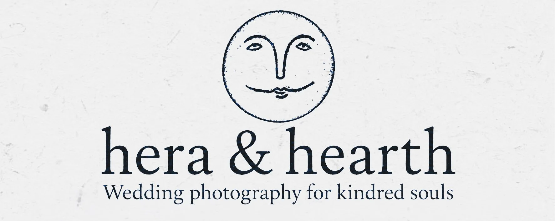 Logo for Hera & Hearth, a wedding photography business with a stylized moon face and the tagline 'Wedding photography for kindred souls.'