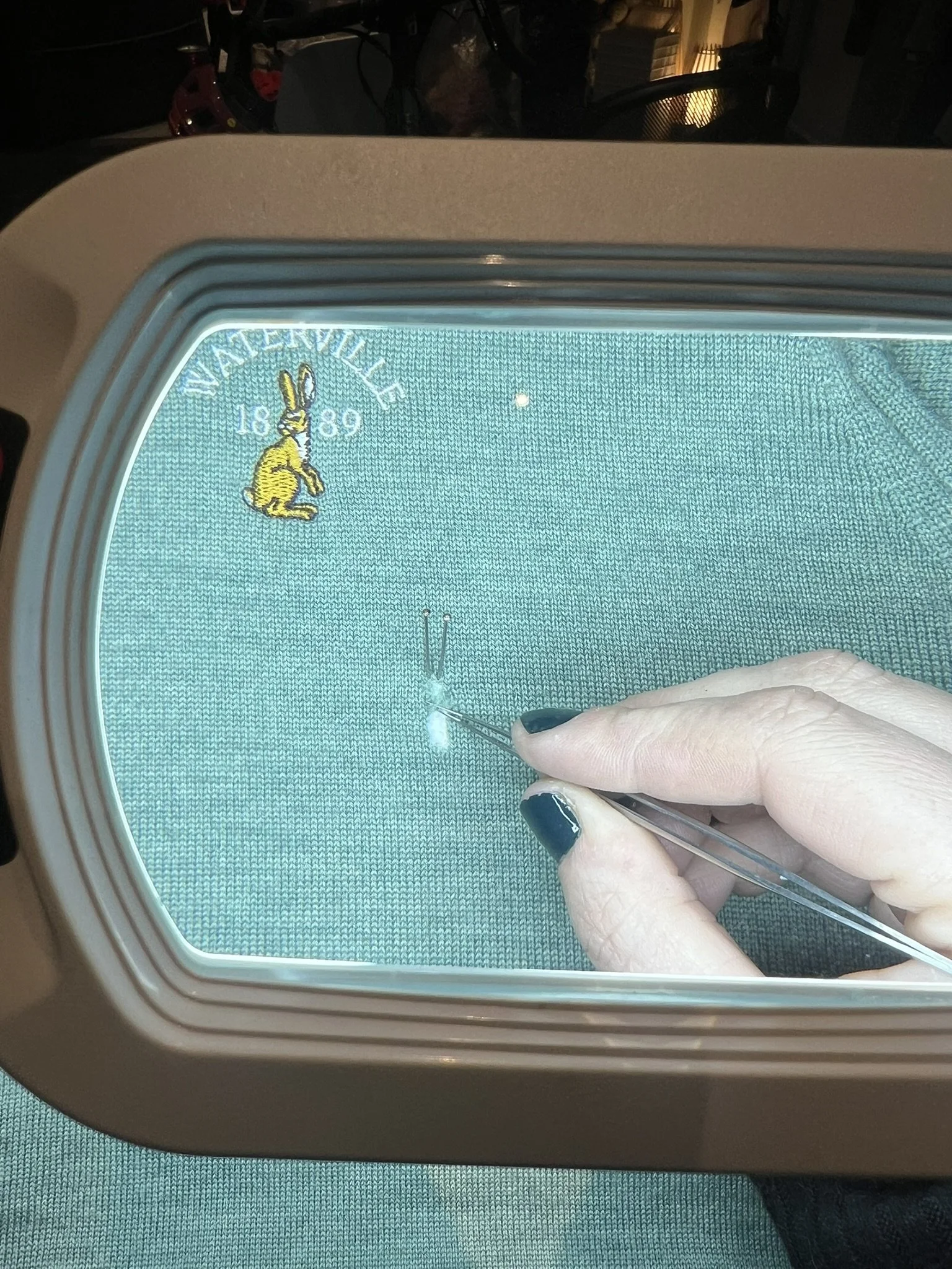Swiss darning repair of a merino knit sweater