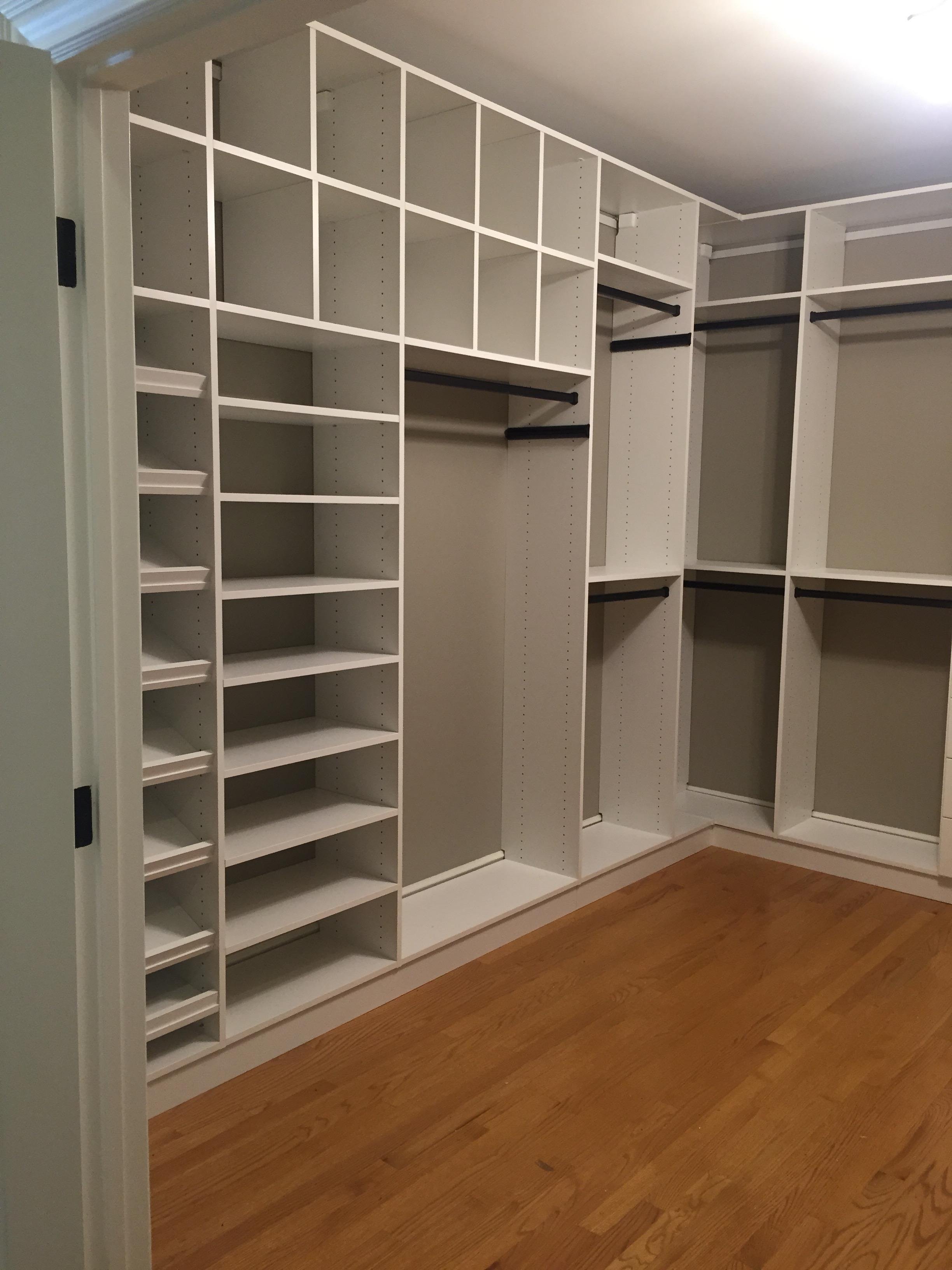 Custom closet installation with built-in shelving and hanging space ready for organization