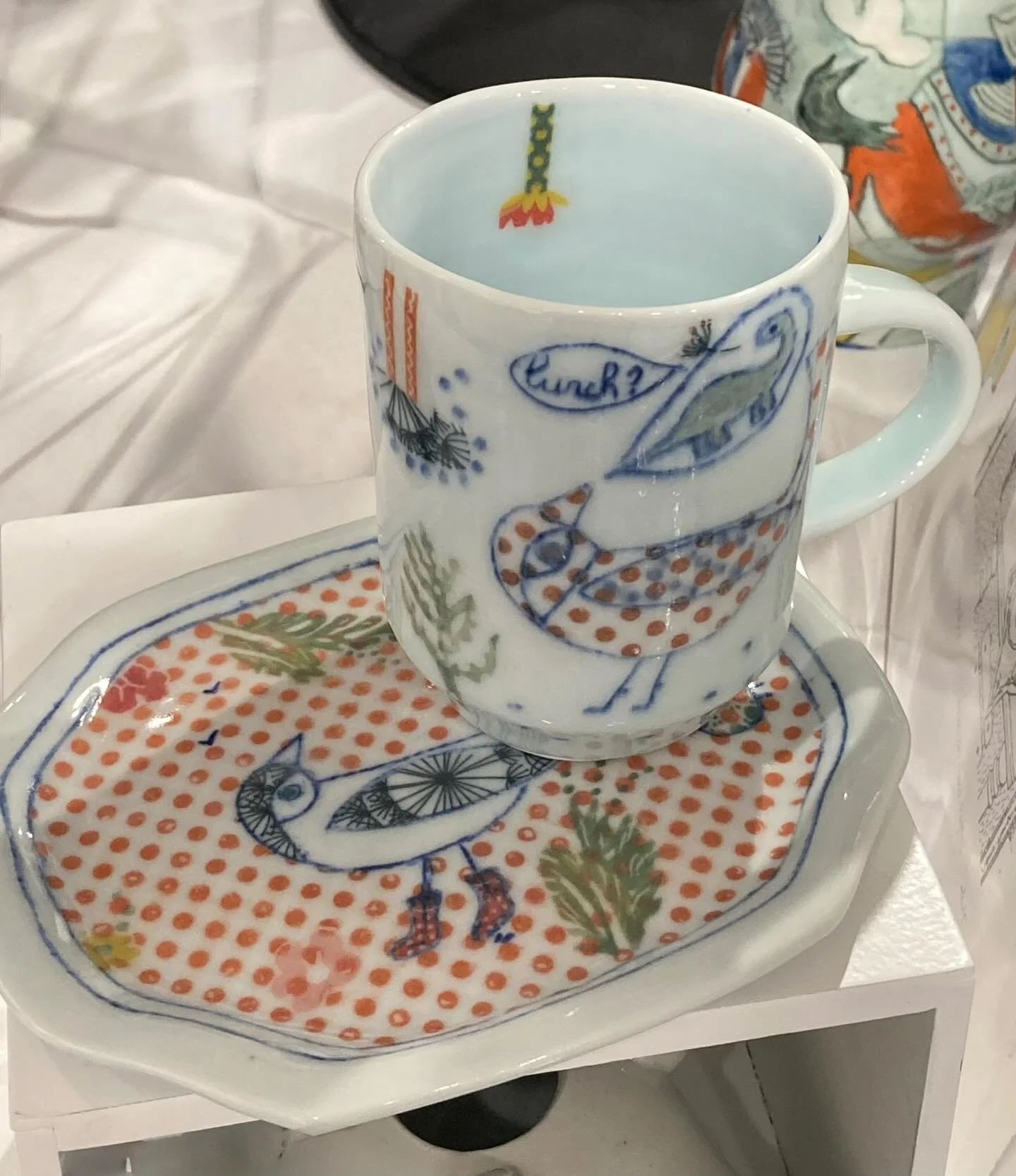 Tray for treats with matching cup. Come and see us at the Evanston Art Center winter expo.
English porcelain, Mishima, underglazes, gas, cone 10.