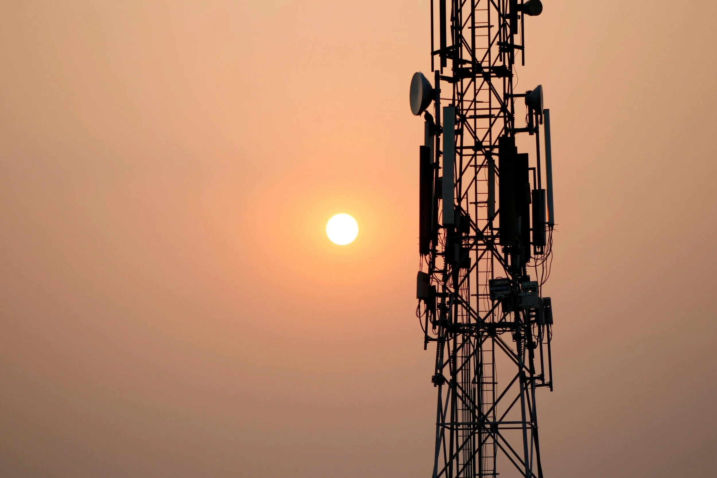 Joe Hackett, sunset, radio, telecommunications tower, orange sky, bright sun, equipment