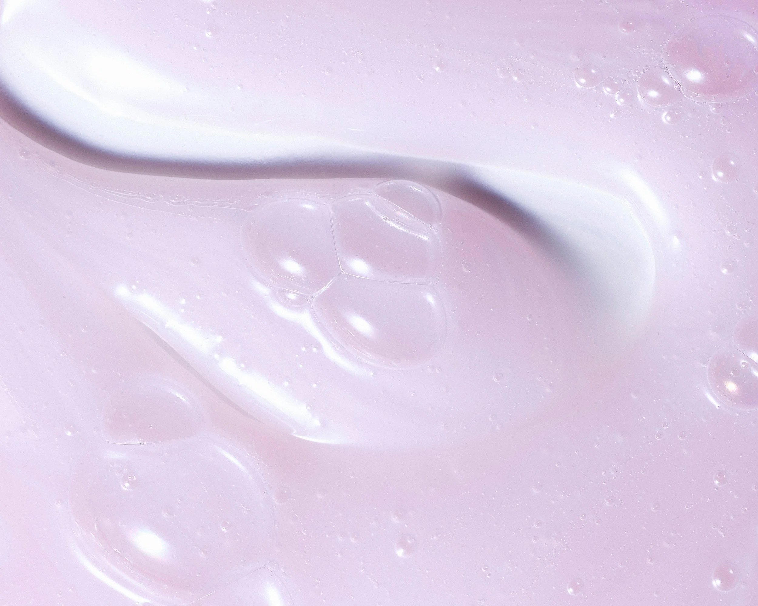 Experiment Skincare Plasma Wash Texture features its soft pink color gel formula and bubbles