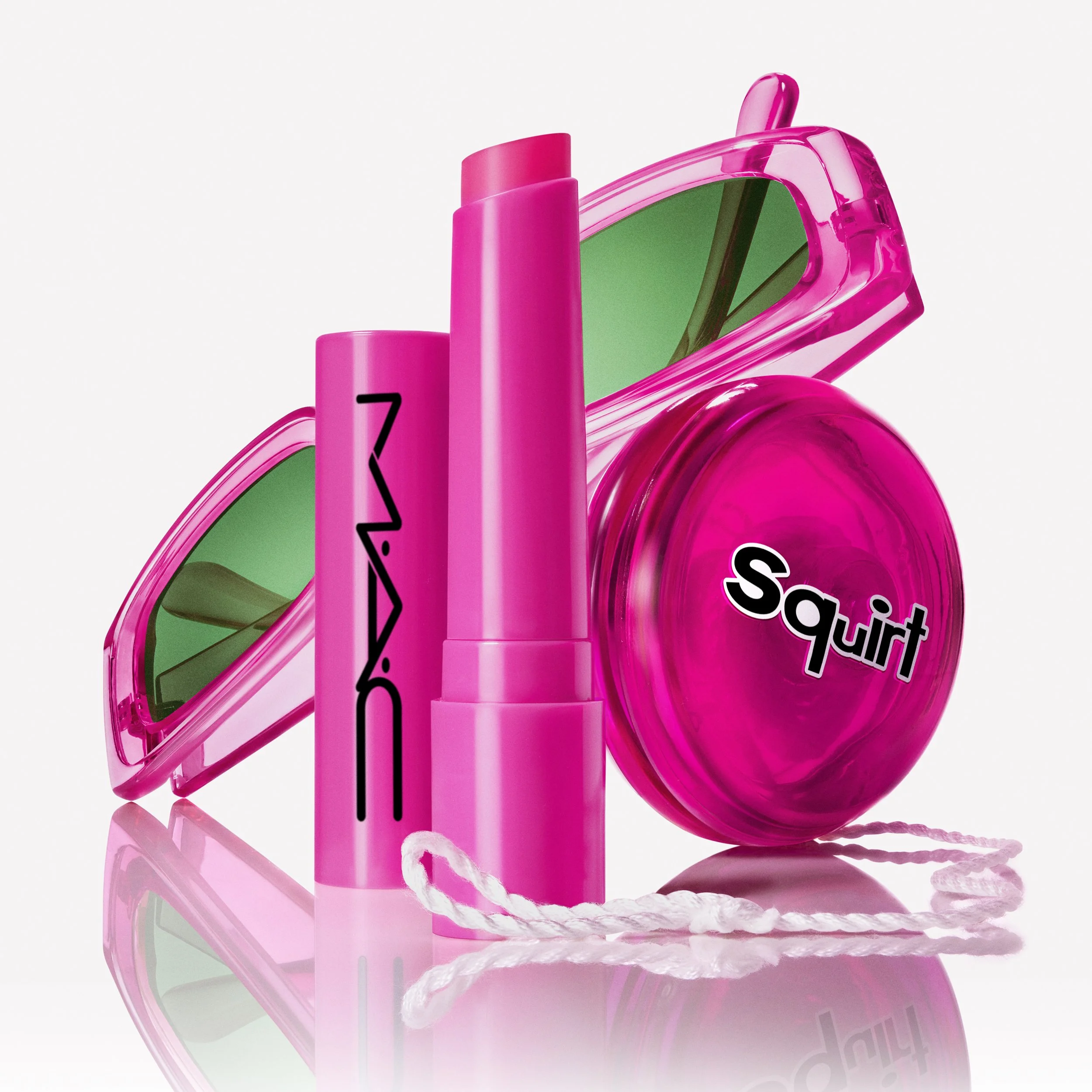 Mac Cosmetics Squirt balm stylized still life with y2k themed props