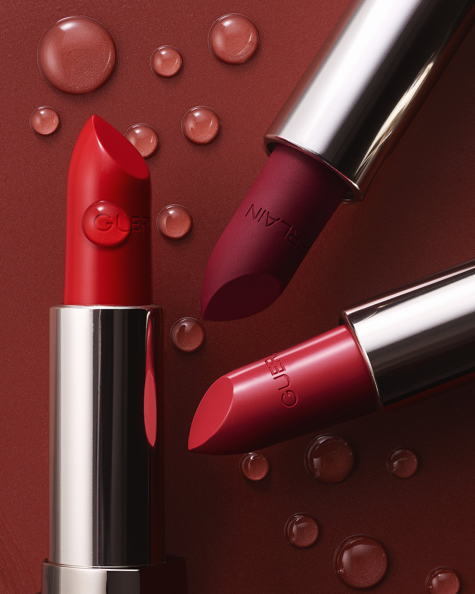 Guerlain Rouge G Lipsticks with moisture droplets