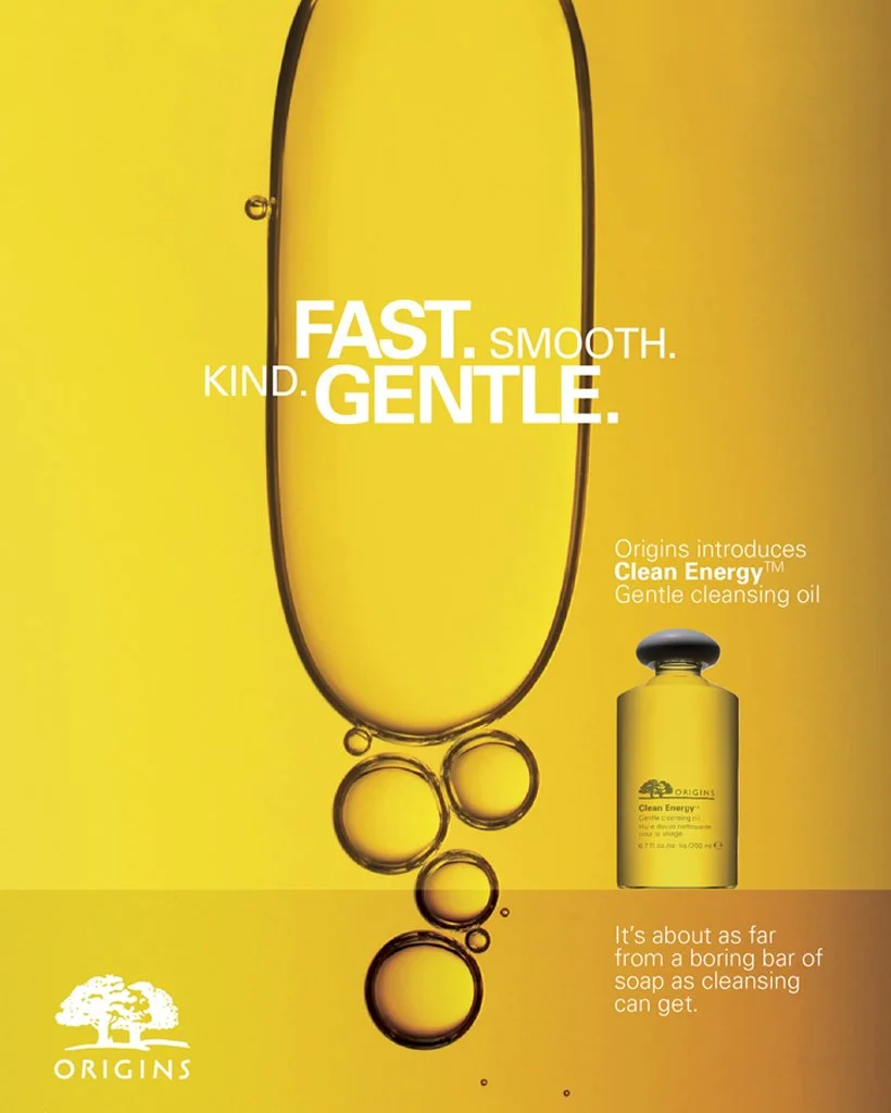 Bright yellow gradient with macro liquid bubbles next to the skincare cleansing product bottle