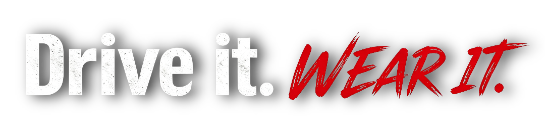 Logo with text 'Drive it. Wear it.' with 'Drive it.' in white and 'Wear It.' in red, stylized font.