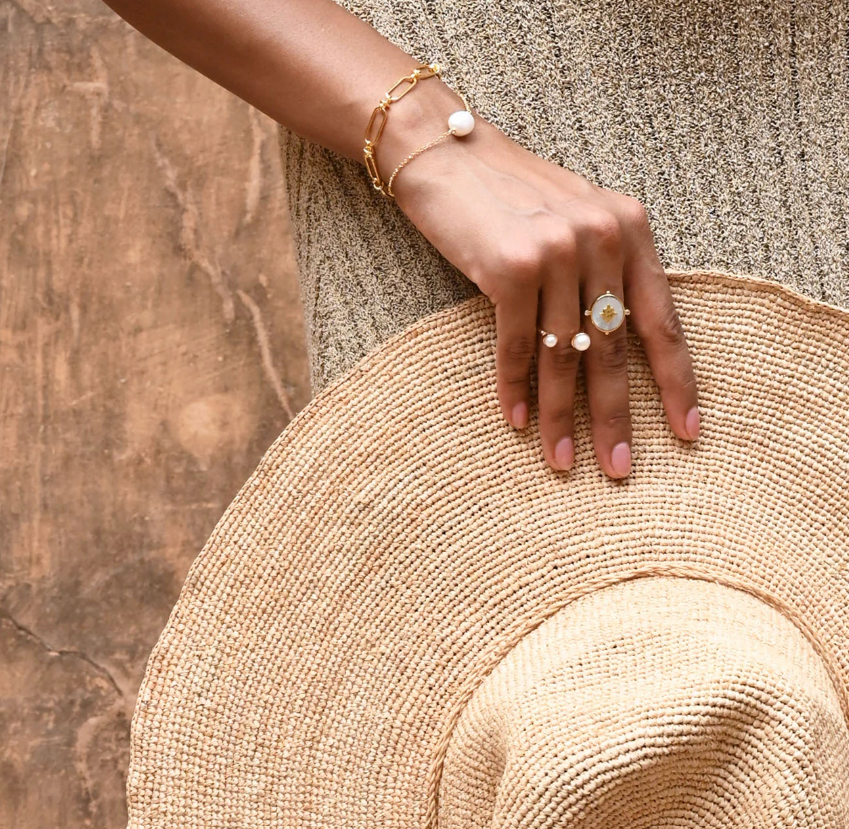 Murkani gold and pearl jewelry on model
