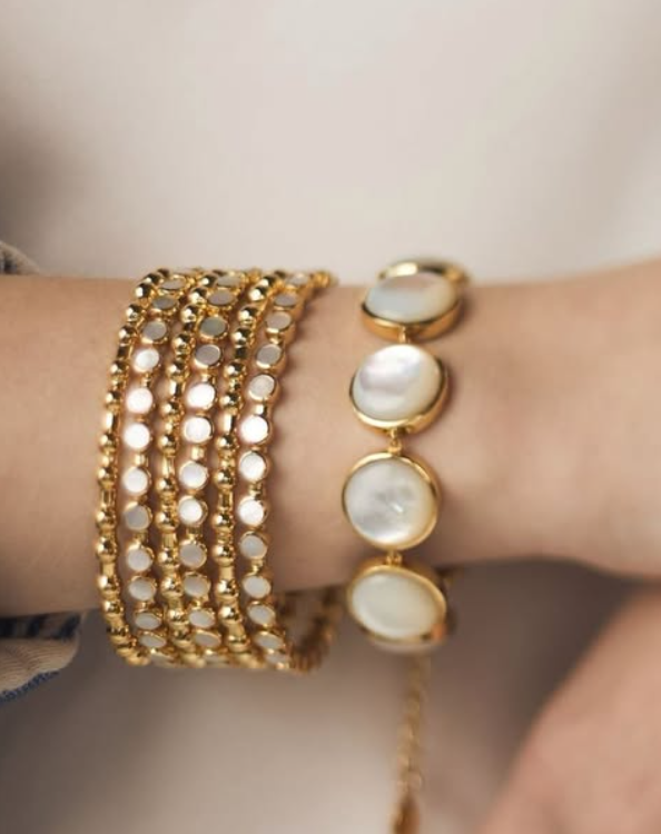 photo of gold and pearlescent bracelet stack