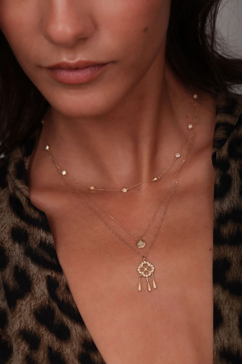 Angele Brousse gold layered necklaces on model