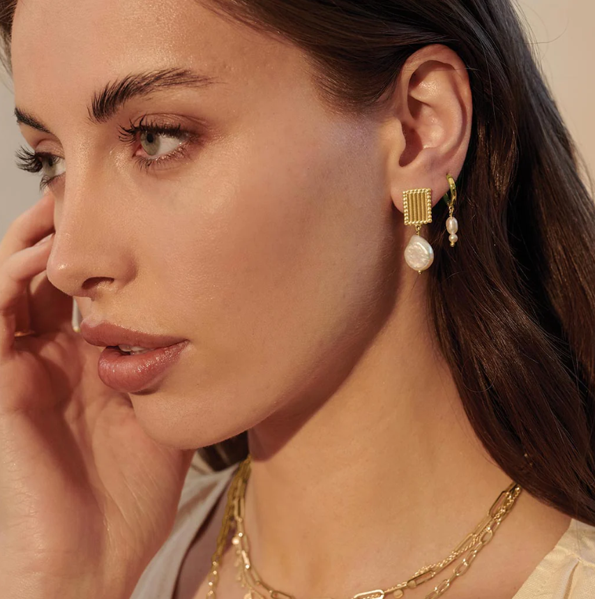 Murkani gold pearl jewelry on model