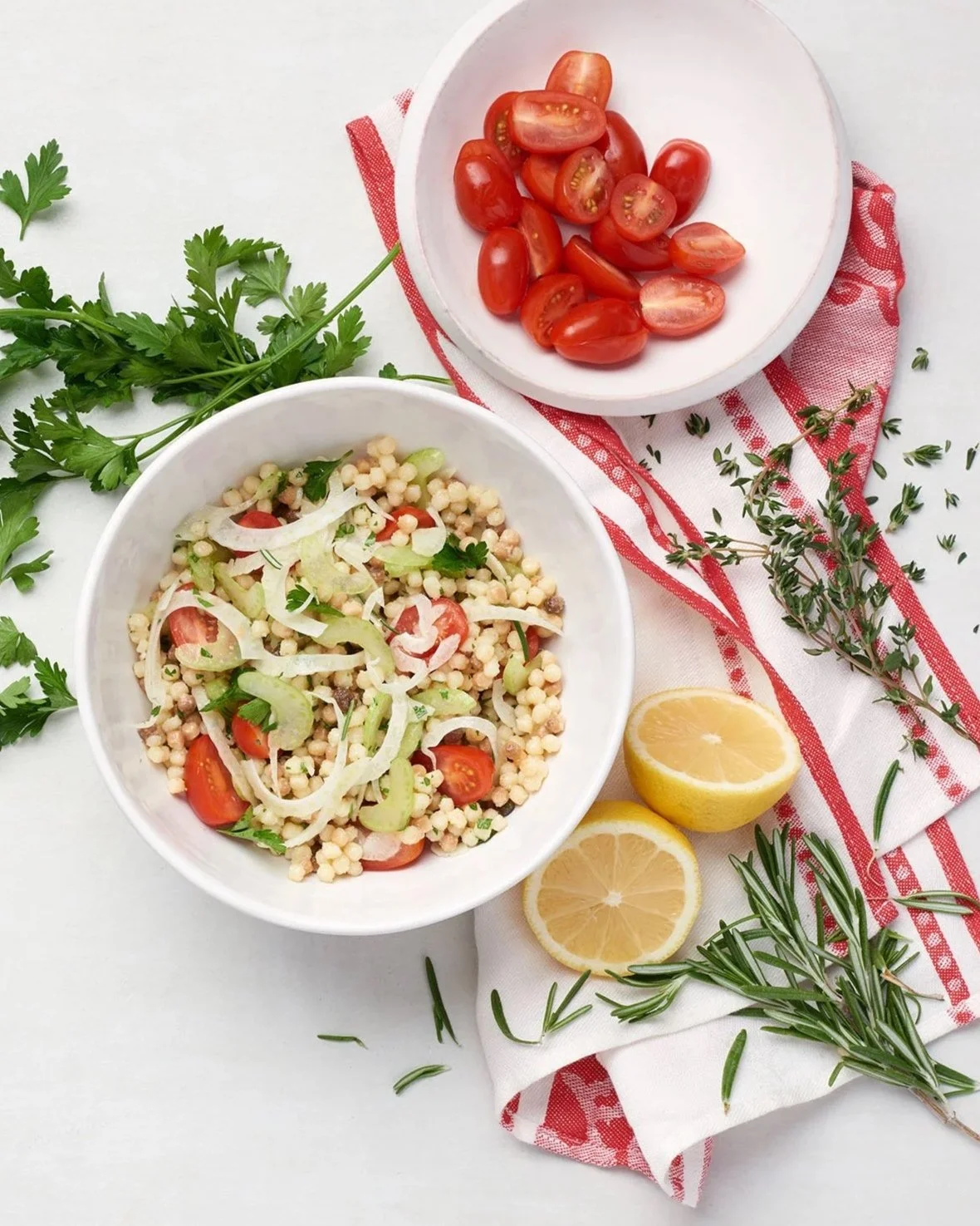 cous cous, fennel and tomato salad with fresh herbs and lemon