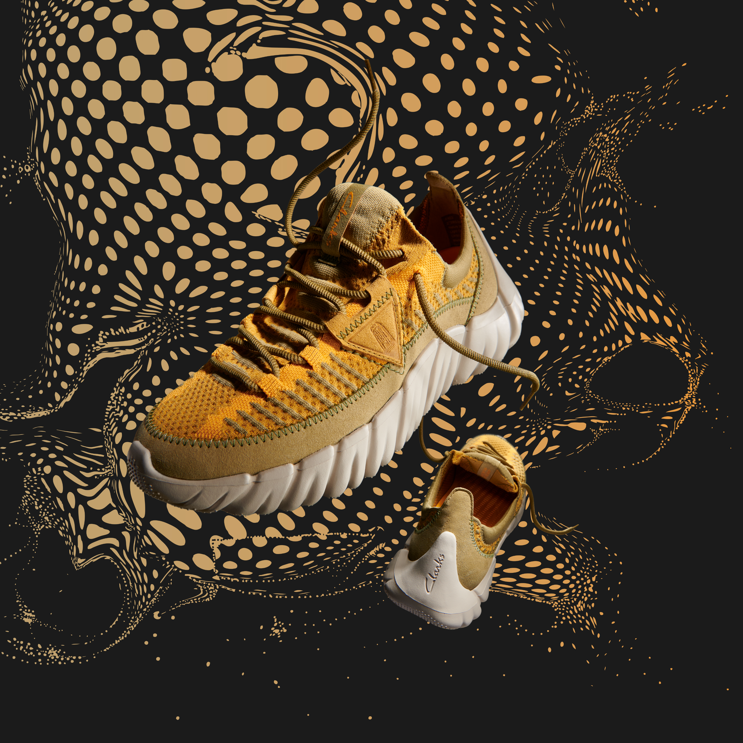 mens eccentric yellow and olive color woven upper sneakers with white soles floating against abstract yellow and black dot pattern background