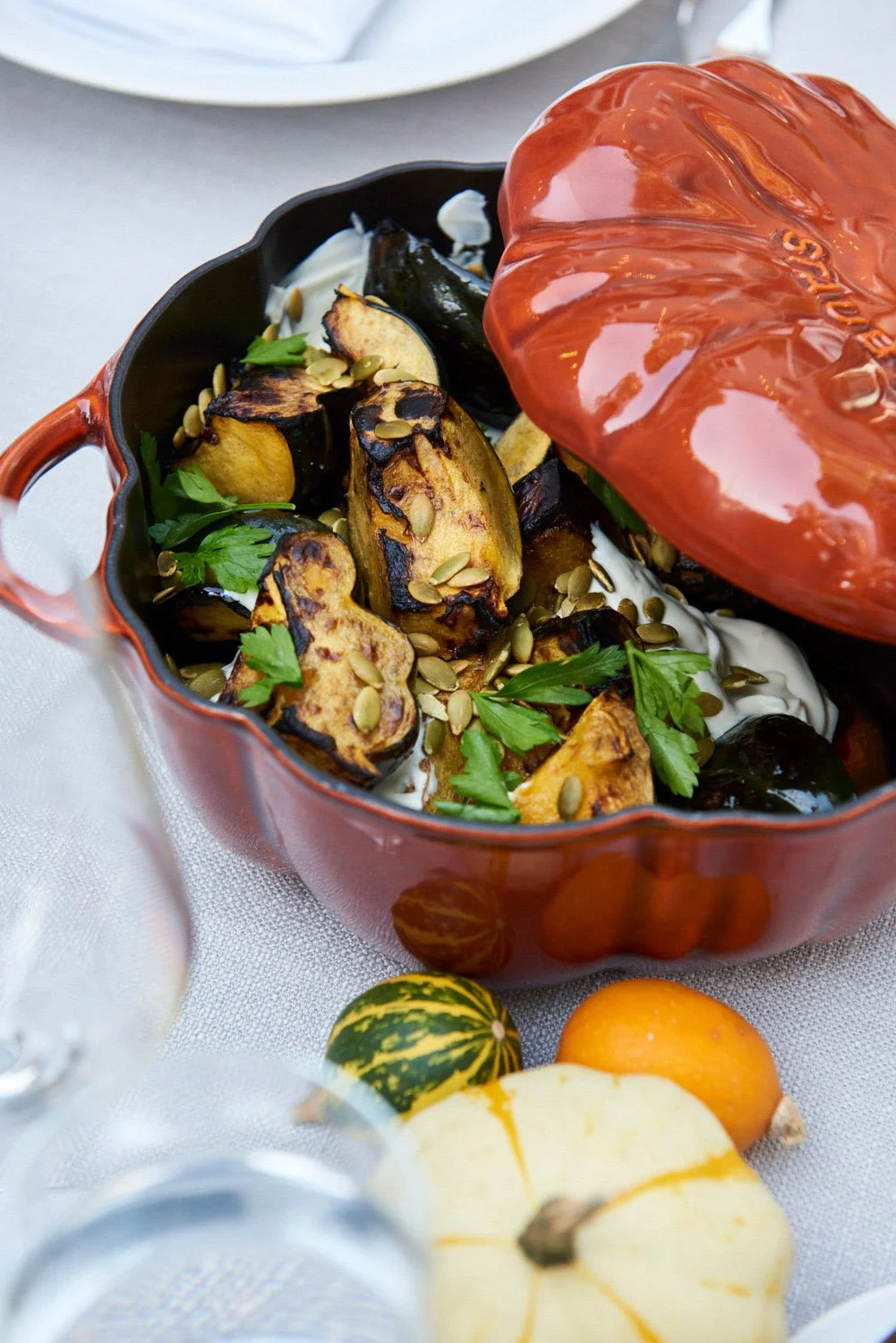 pumpkin design serving dish with cooked squash inside