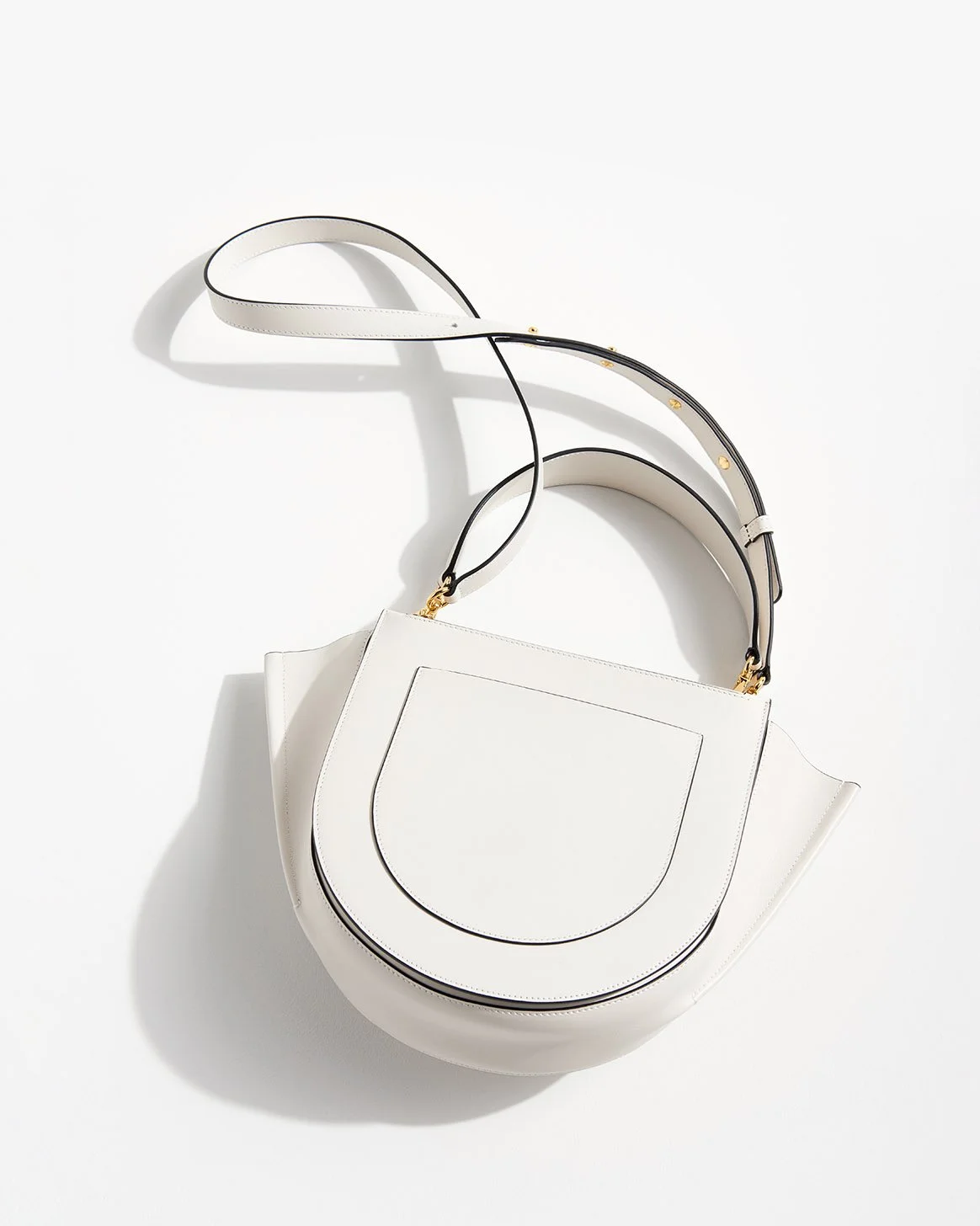 white modern shape handbag on white background with strong sunlight
