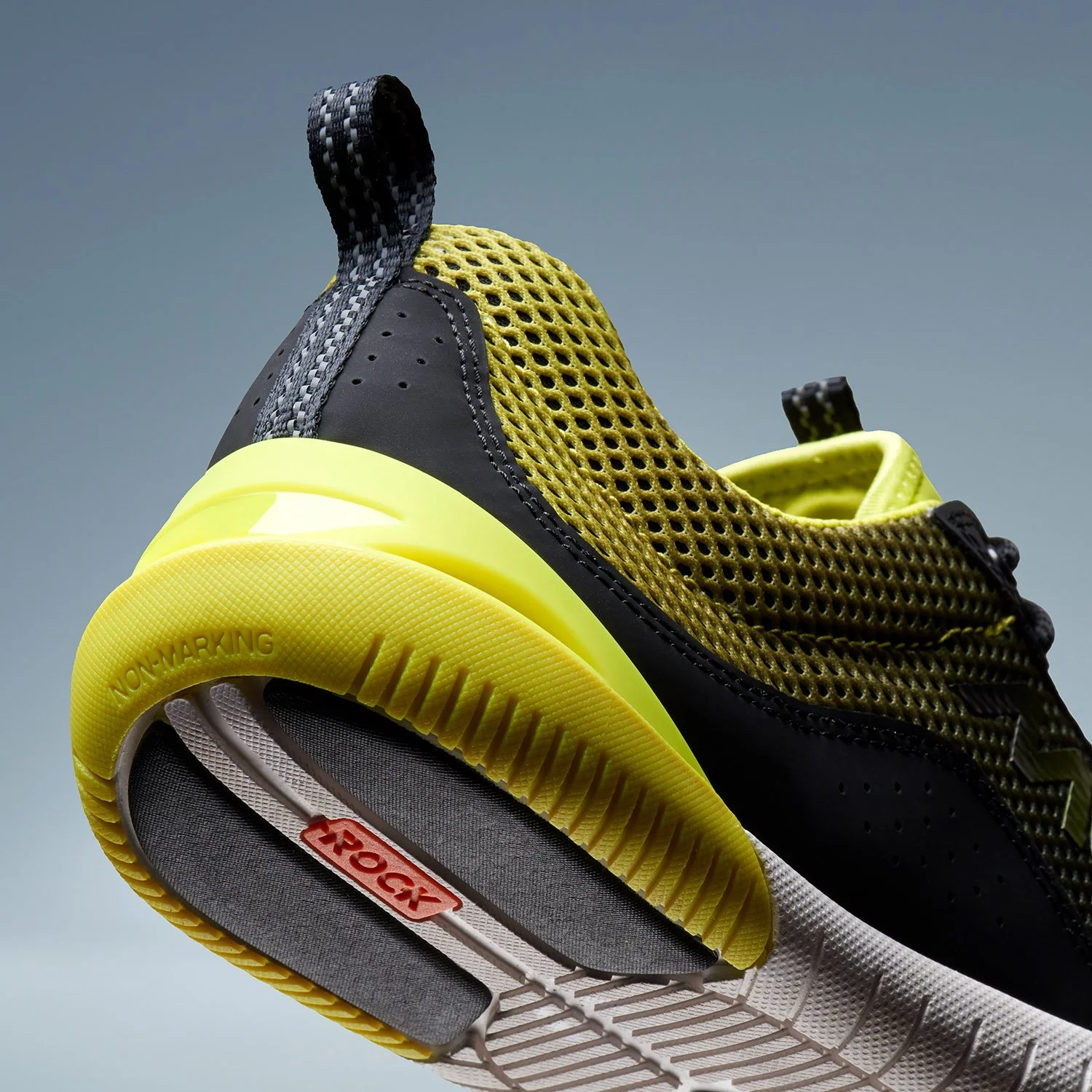 closeup of mens anti-marking sneaker in yellow black and white colors