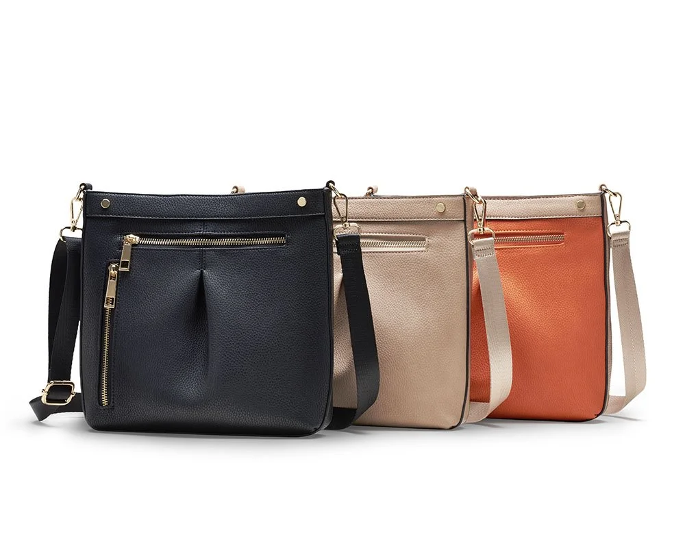 leather handbags arranged in staggered patten on white background