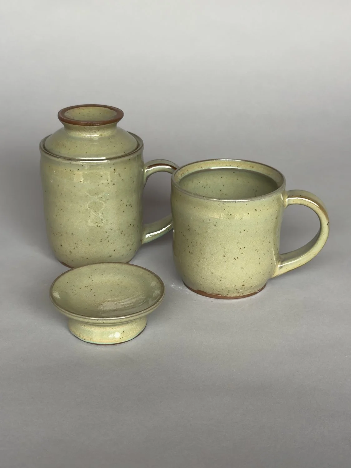 Handmade ceramic pour over coffee set with matching mug and dripper in soft sage green glaze by Jeanette Burgett Ceramics.