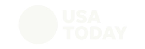 USA Today logo with a white circle and bold text on a black background.
