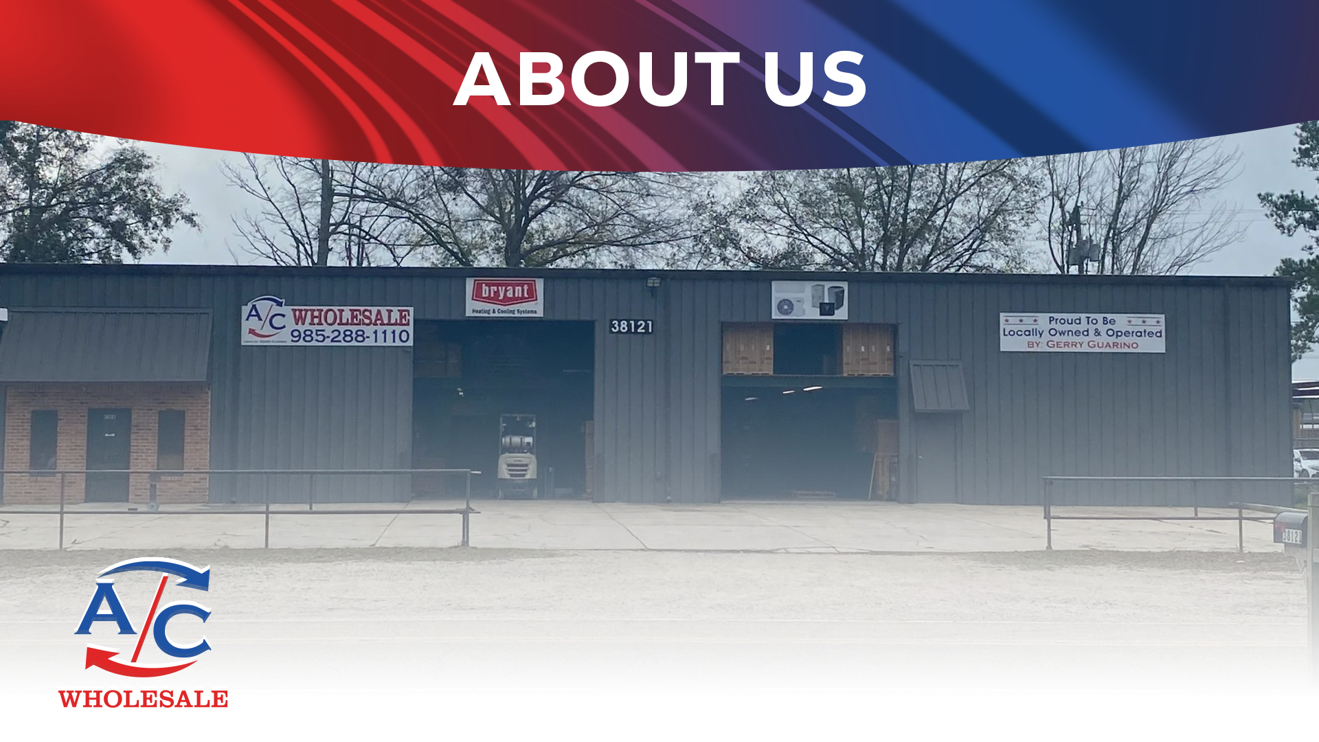 Exterior view of an industrial building with signs for A/C Wholesale and Bryant Heating & Cooling Systems, located at 38121 with a clear sky and trees in the background.