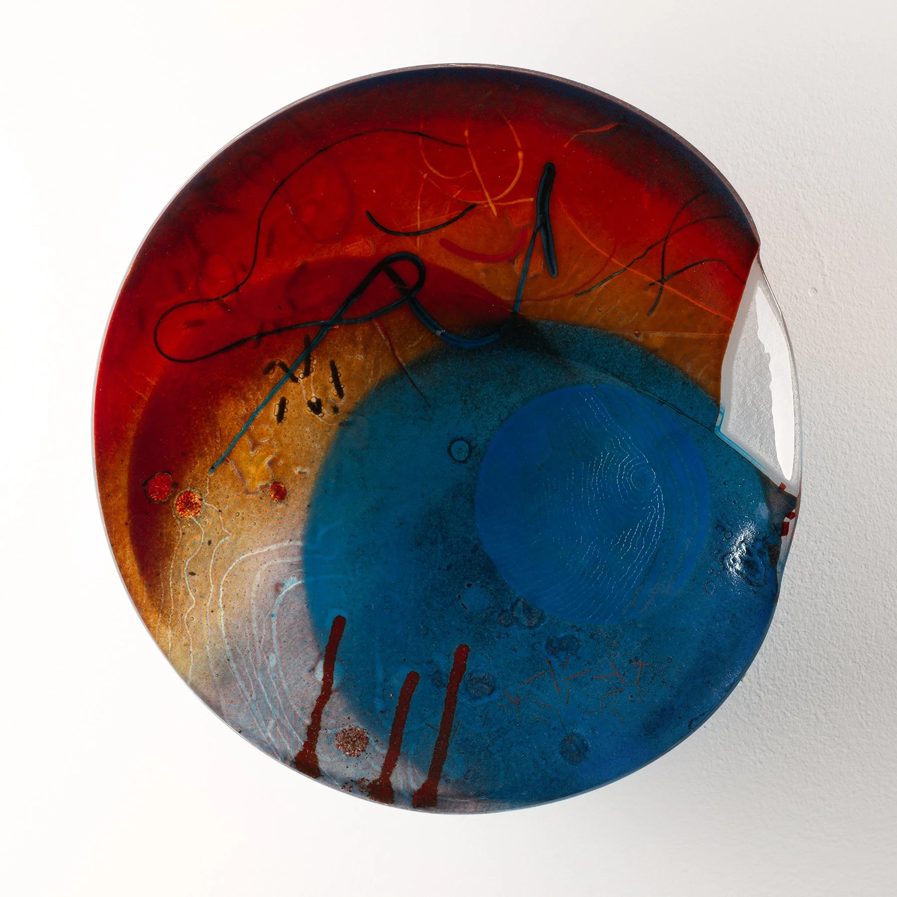 Colorful abstract glass art with swirling blue and red hues, black and red lines, and textured details.