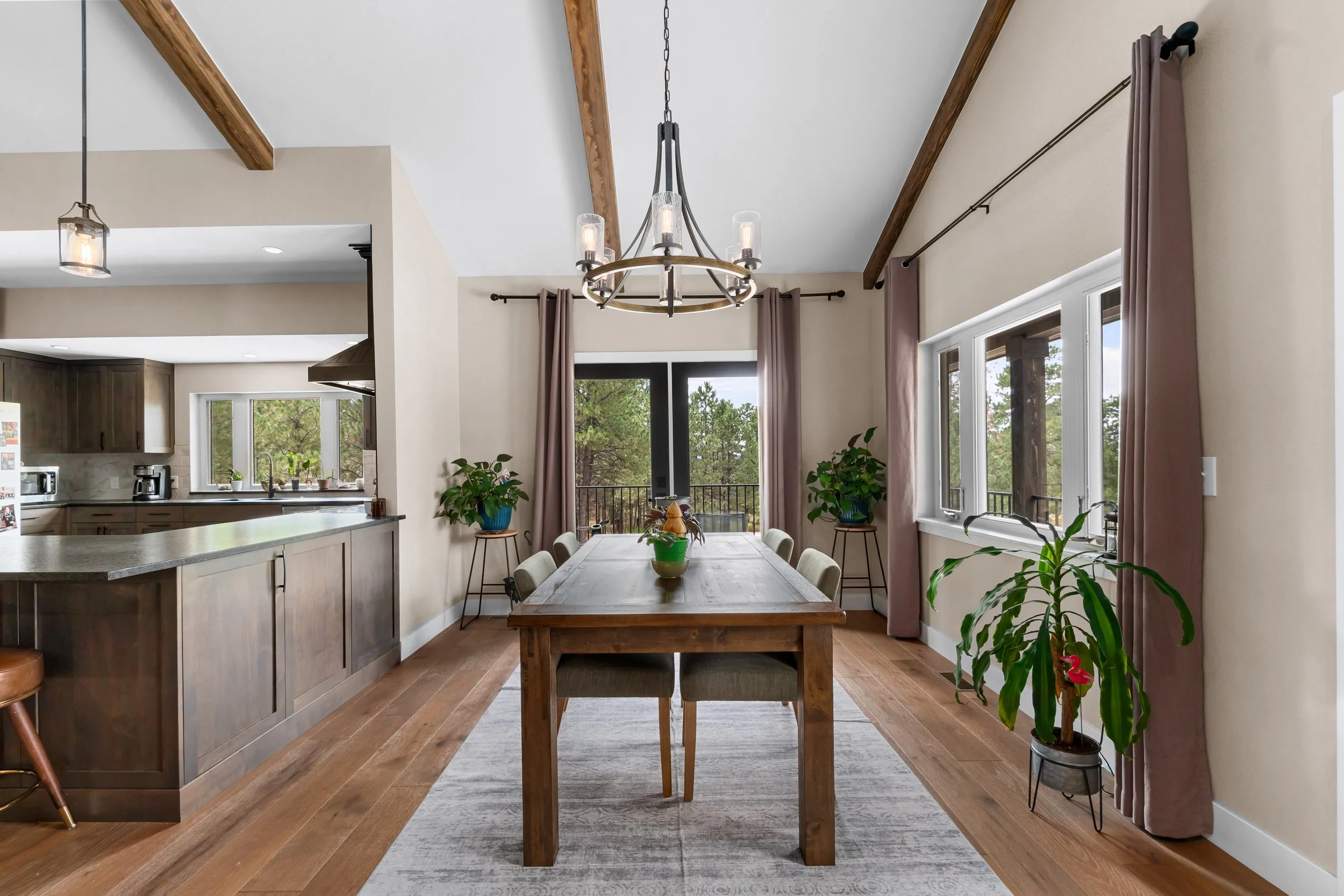 Custom ceiling beams, cabinetry, flooring, light fixtures in custom Colorado mountain home.