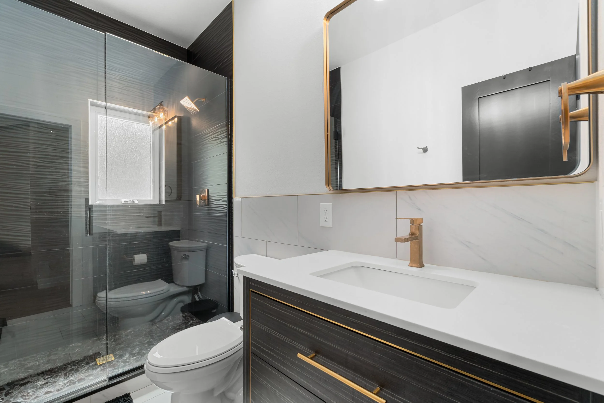 Secondary bathroom vanity, new plumbing, custom tile work in custom Colorado house.