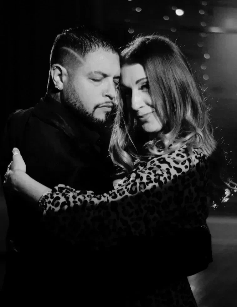Two actors share a close dance embrace in Robbie, an immersive theater show in Eureka Springs Arkansas near Fayetteville, Bentonville, Rogers, and Springdale.