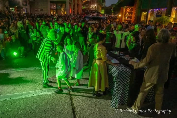 Dancers performing a Beetlejuice inspired flash mob in front of hundreds of people after the parade at the Eureka Springs Arkansas.