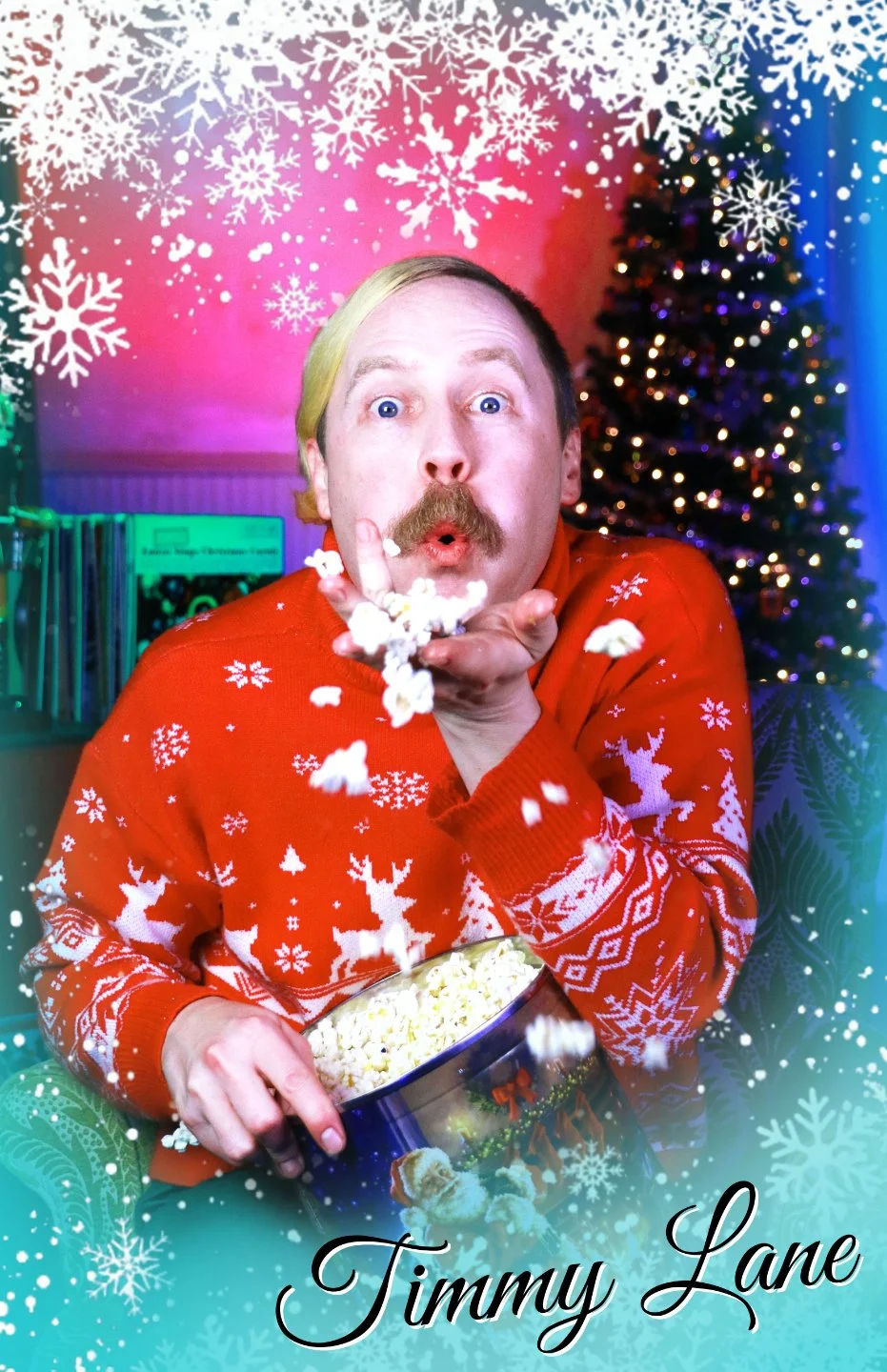 An actor in a red Christmas sweater posing with a popcorn tin in Christmas With the Rosses, an immersive theater show in Eureka Springs Arkansas near Fayetteville, Bentonville, Rogers, and Springdale.