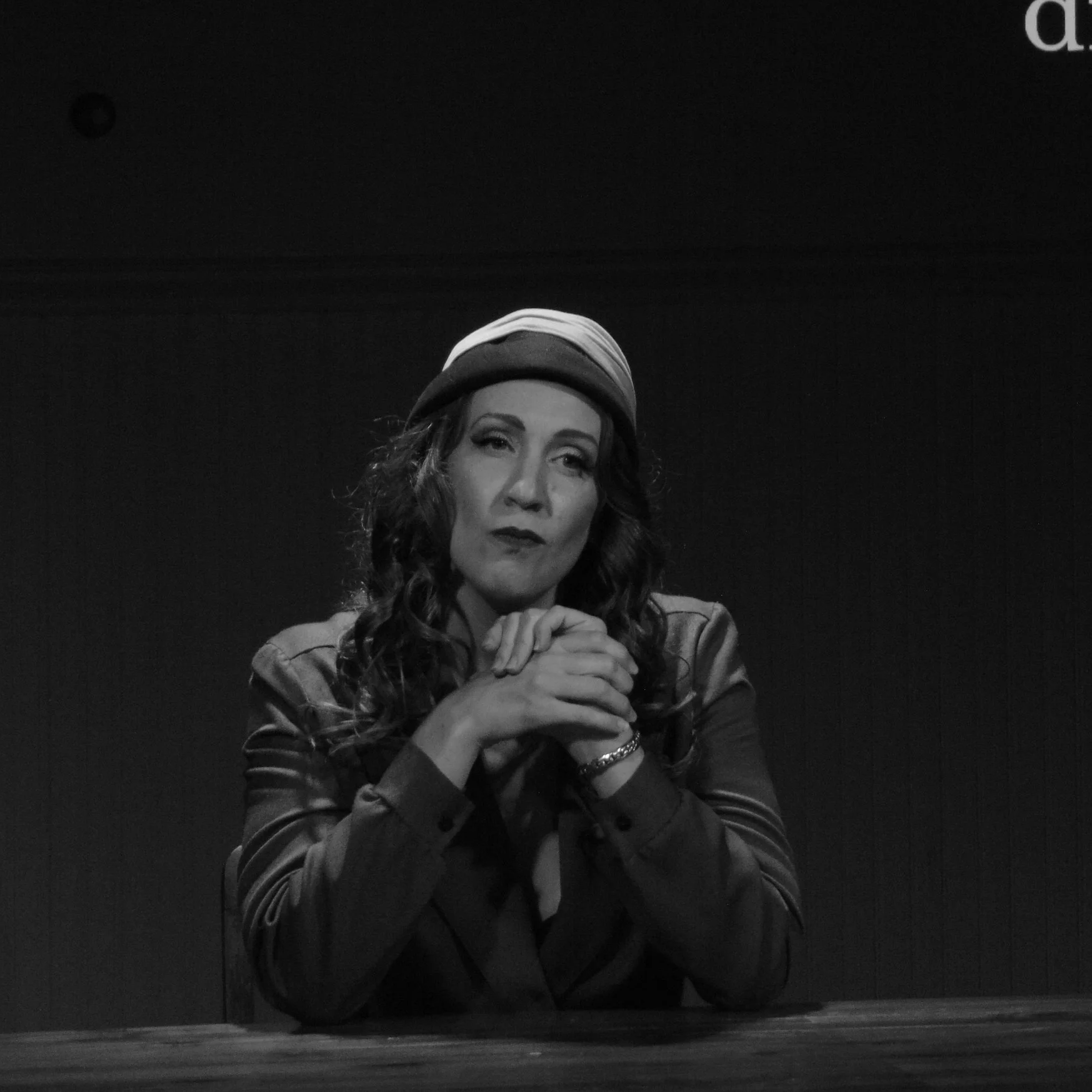 An actor giving a suspicious look in Robbie, an immersive THEATER show in Eureka Springs Arkansas near Bentonville, Fayetteville, Springdale and Rogers.