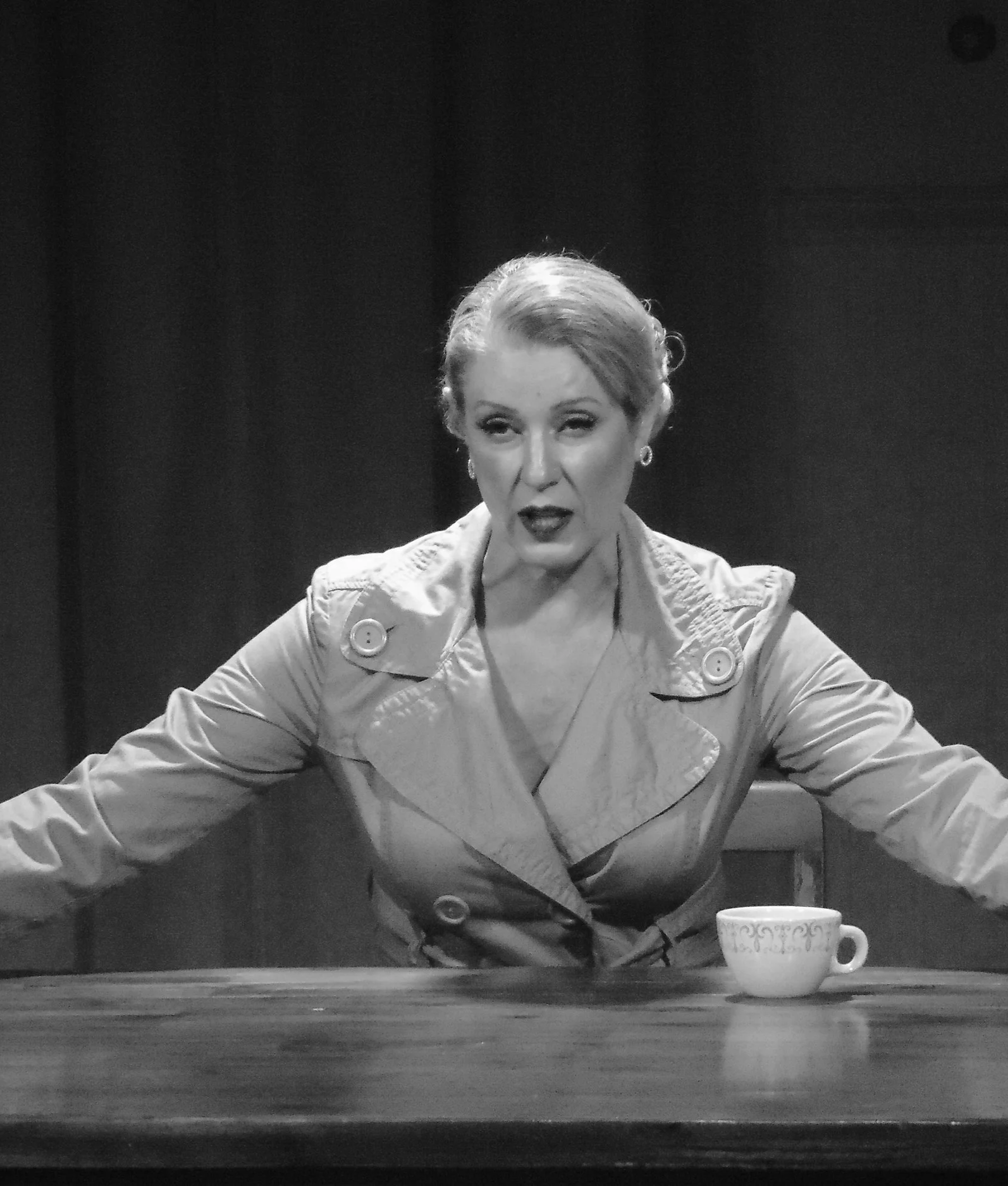 An actor facing interrogation in Robbie, an immersive theater show in Eureka Springs Arkansas near Fayetteville, Bentonville, Rogers, and Springdale.