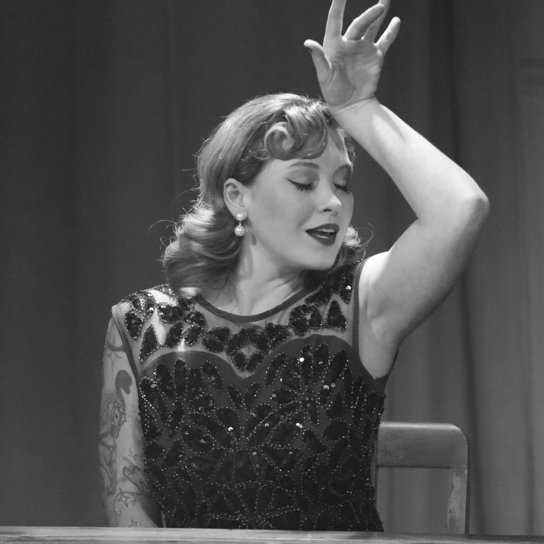 Actor posing dramatically in Robbie, an immersive theater show in Eureka Springs Arkansas near Bentonville, Fayetteville, Rogers, and Springdale.