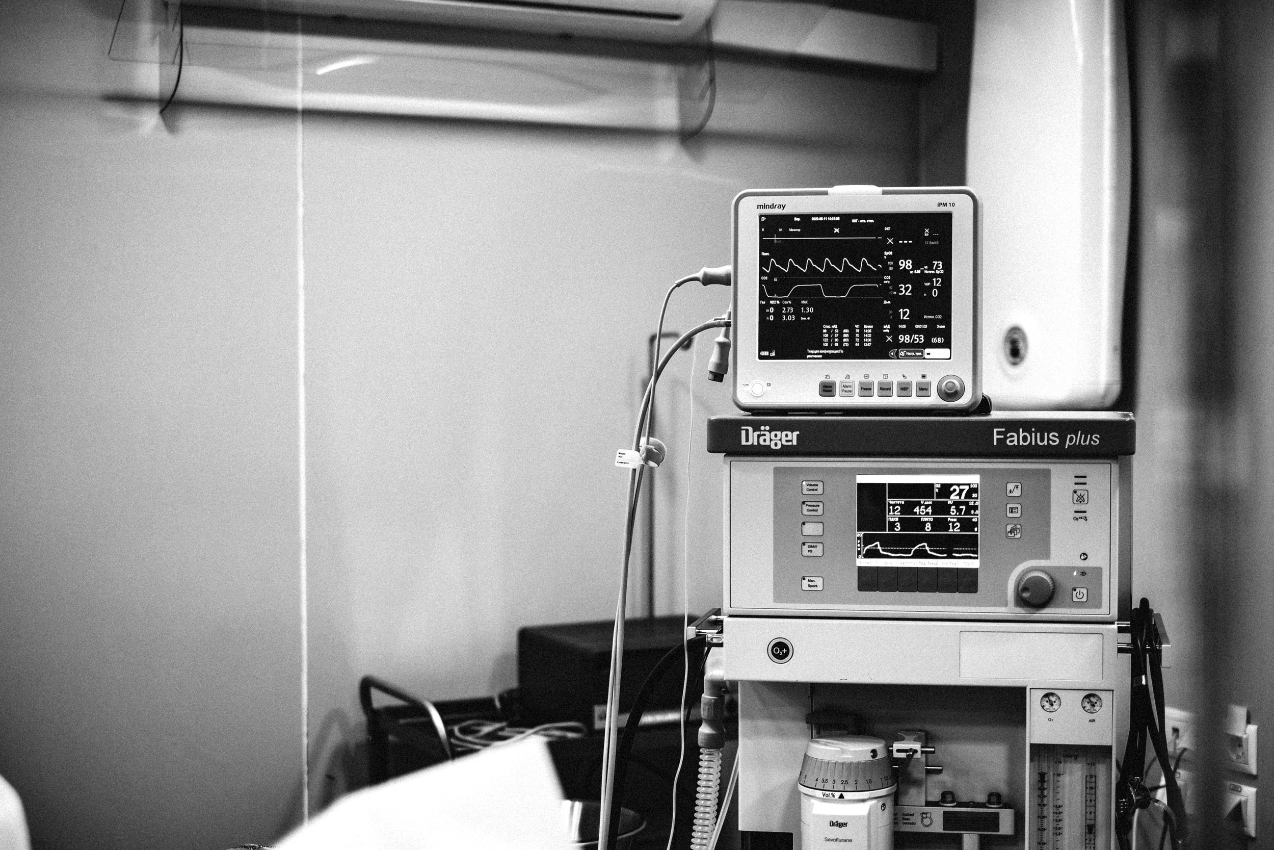Medical monitors displaying patient vital signs in a hospital room.