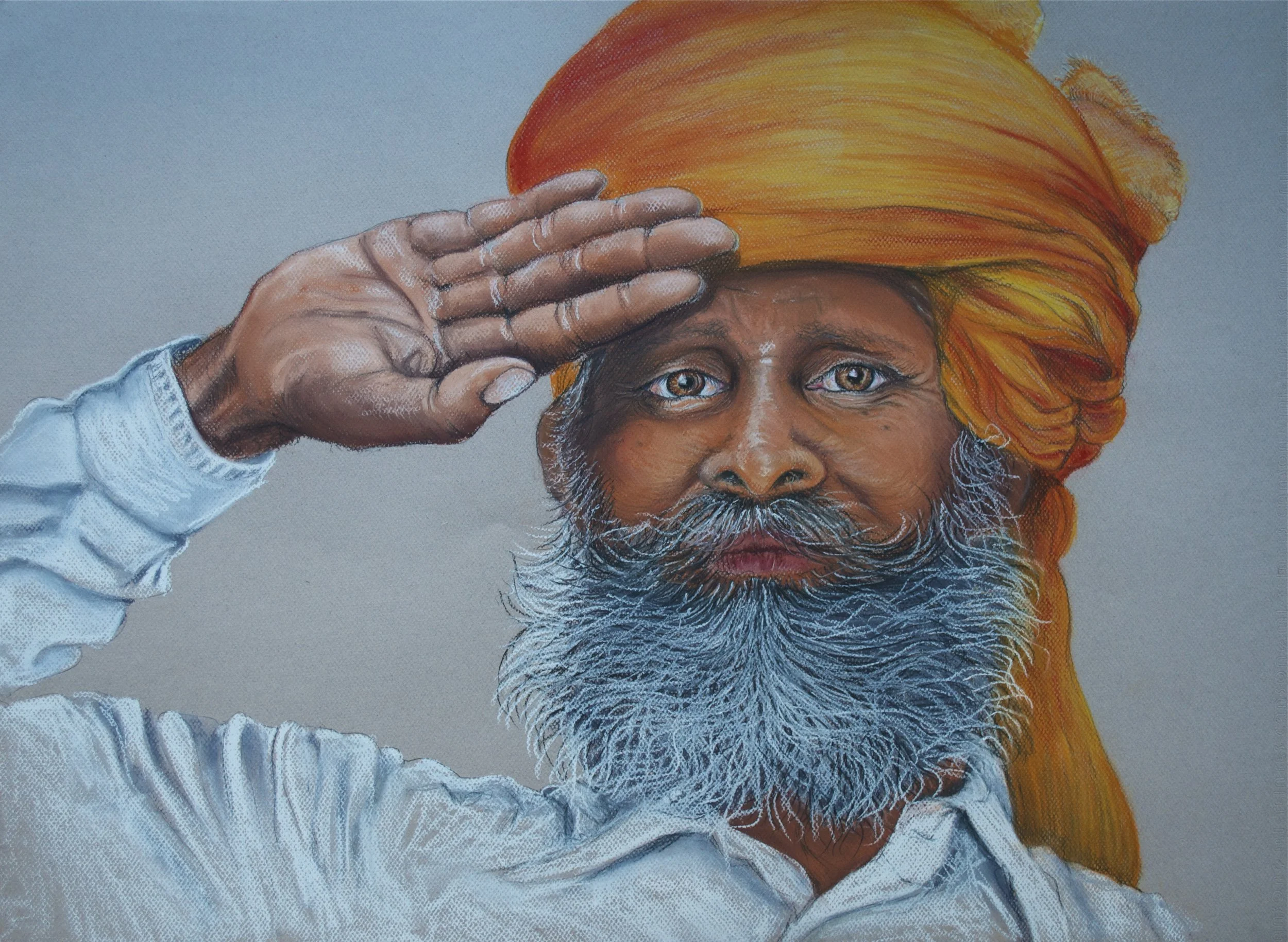 Portrait of an elderly man with a blue and white beard, wearing a bright orange turban, saluting with his right hand, dressed in a white shirt against a grey background.