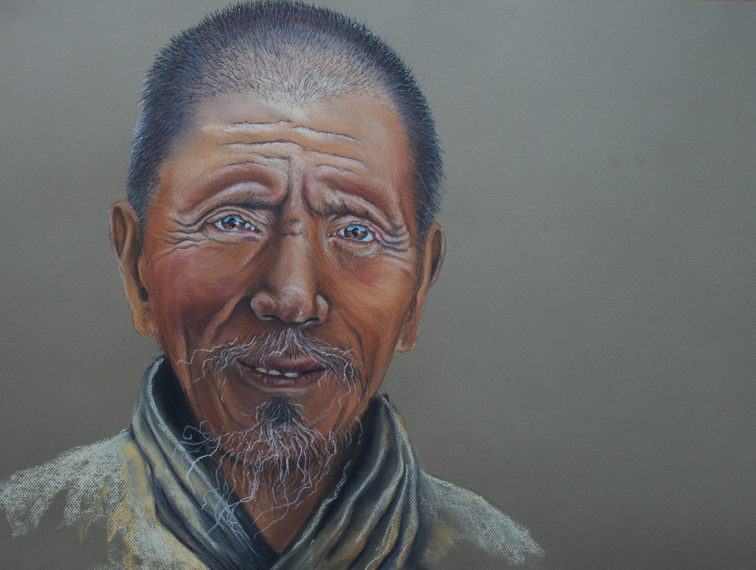 Portrait of an elderly Asian man with short gray hair, a gray beard, and a mustache, wearing traditional clothing.